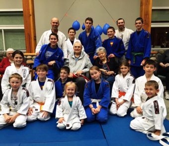 Sensei James Ramsey surround by Campbell River judoka and instructors
